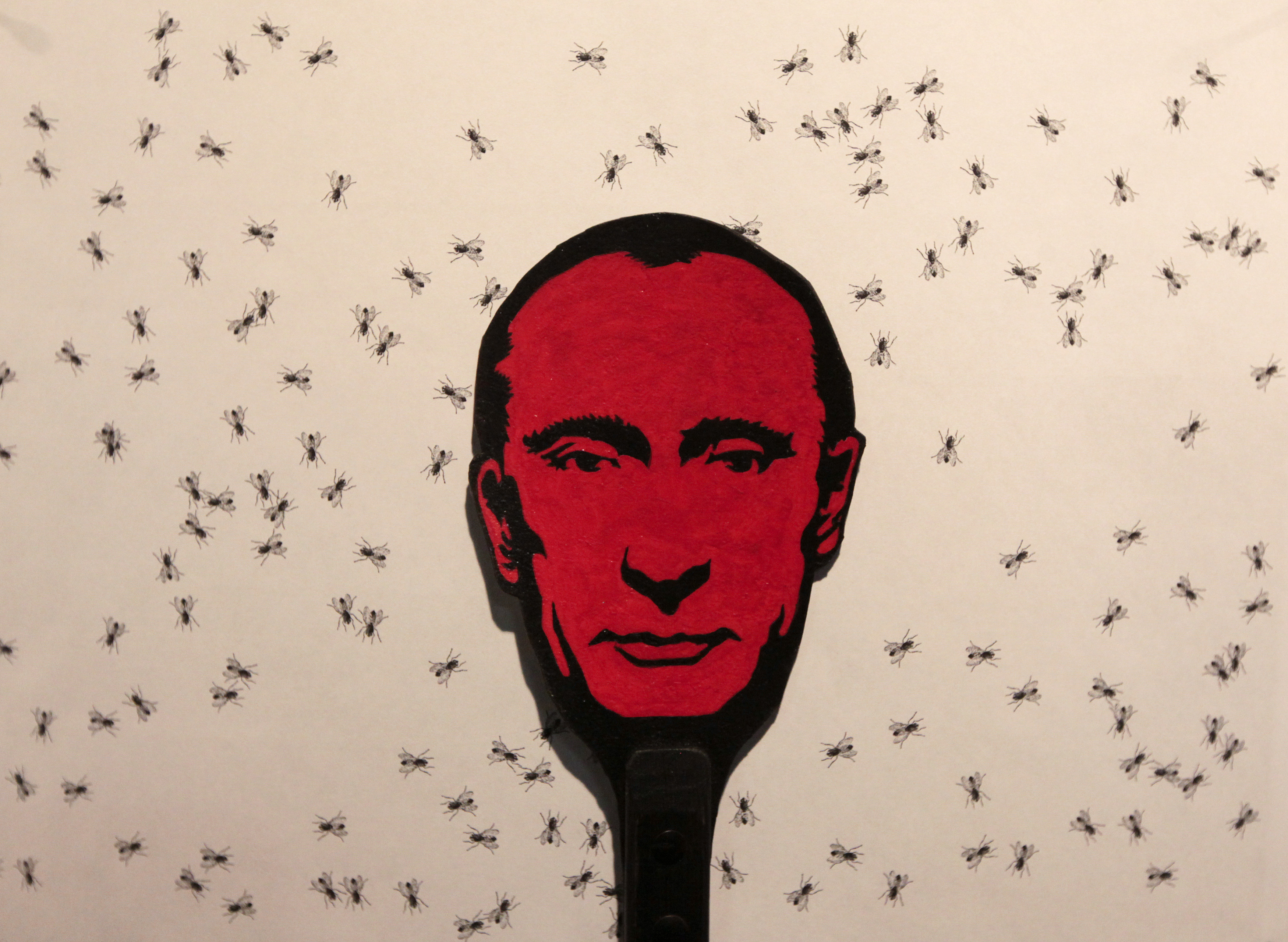 A flyswatter displaying an image of  Russia's President Vladimir Putin, which is part of an art installation by Russian artist Vasily Slonov, is on display at the Krasnoyarsk Museum Centre