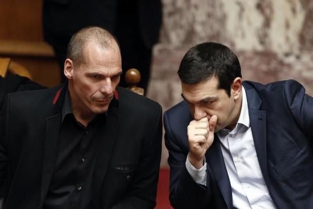 Greek Prime Minister Alexis Tsipras (R) and Finance Minister Yanis Varoufakis look on during the first round of a presidential vote at the Greek parliament in Athens, February 18, 2015. REUTERS/Alkis Konstantinidis
